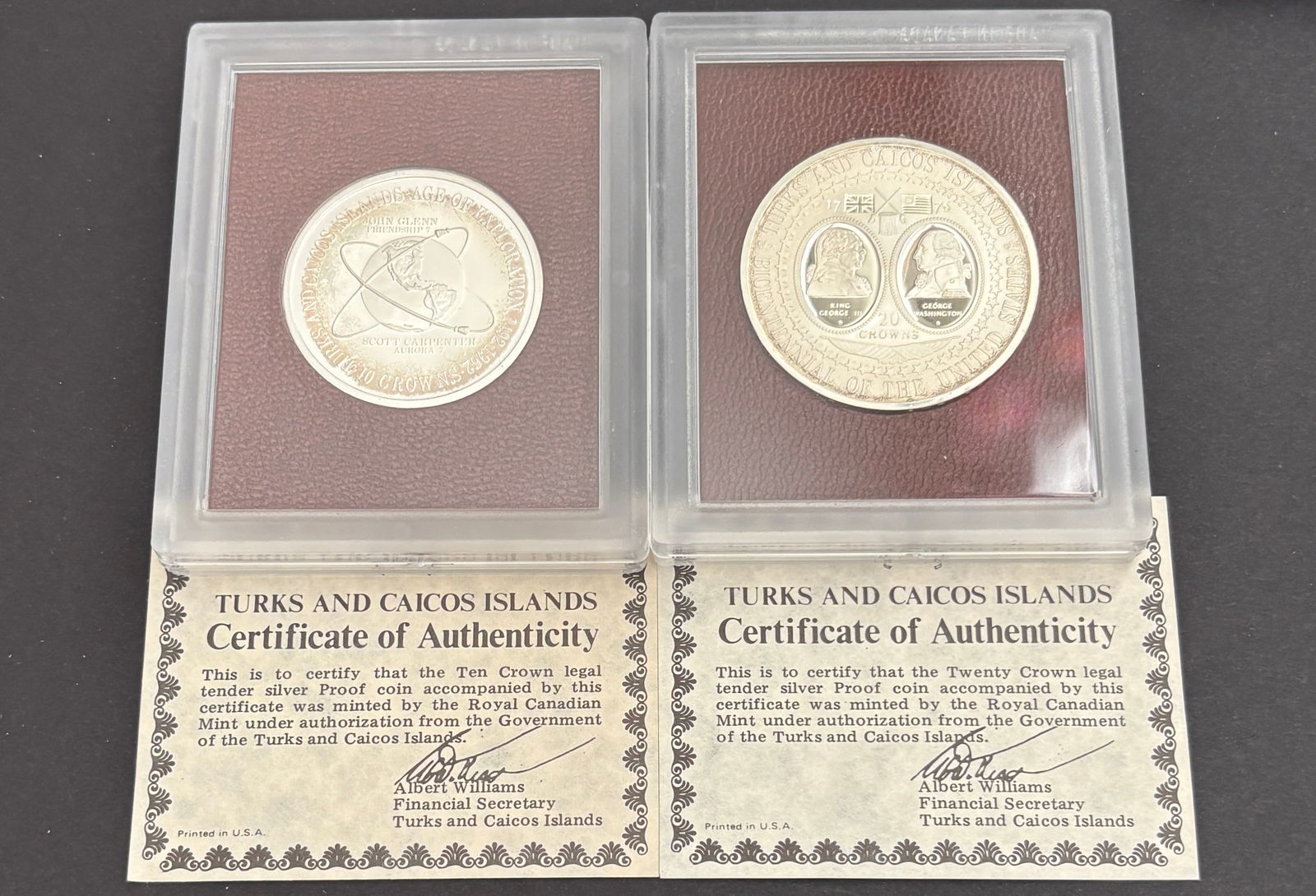 1975 & 1976 Turks And Caicos Islands Silver Proof Crown Coins With COAs: Pair of Turks and Caicos Islands silver proof crown coins comprising a 1975 Ten Crown Proof and a 1976 Twenty Crown Proof, each struck in silver and issued with original Certificate of Authenticity. T