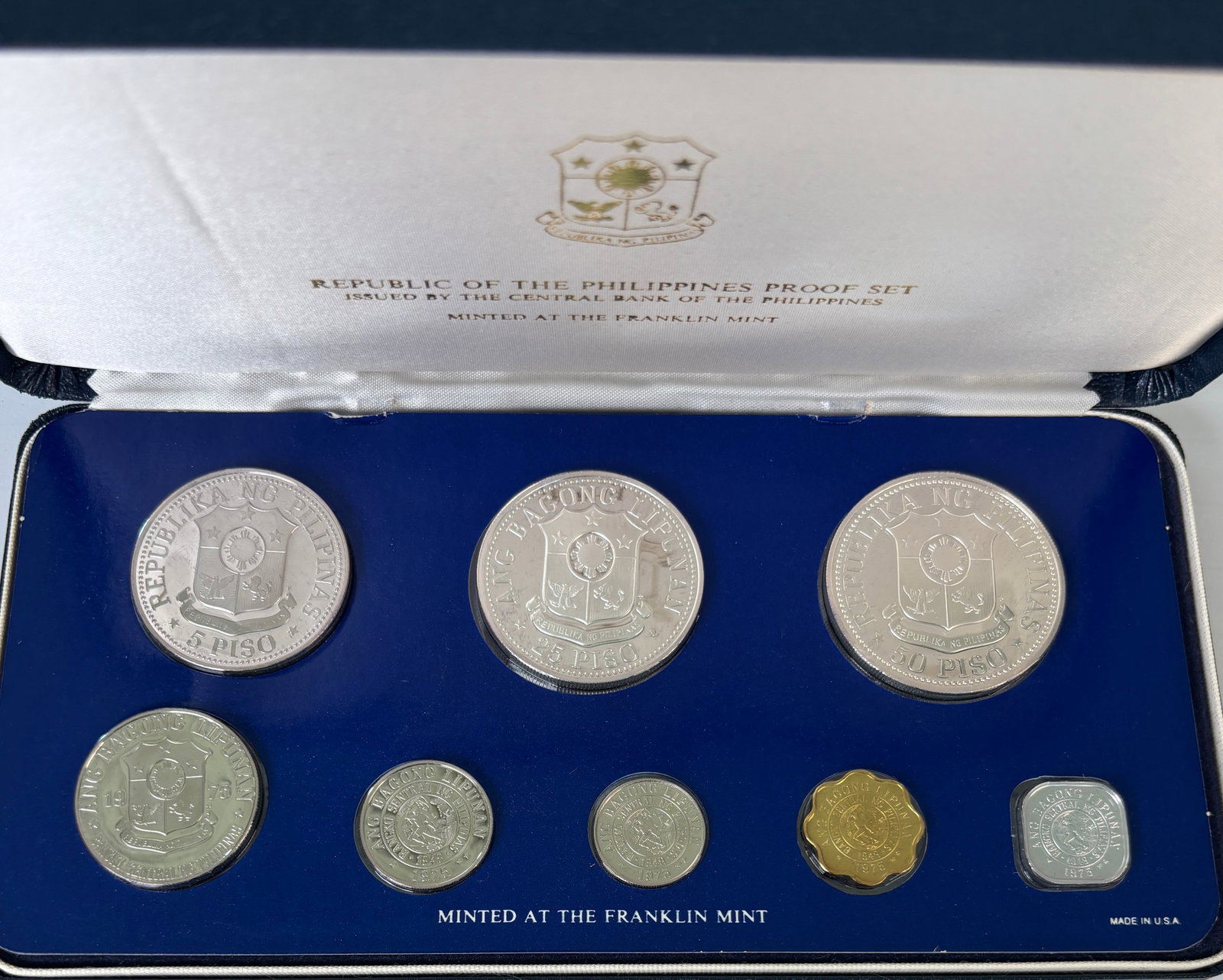 1975 Republic of the Philippines 8-coin proof set: 1975 Republic of the Philippines 8-coin proof set issued by the Central Bank of the Philippines and minted by the Franklin Mint , featuring high-quality proof strikes including a sterling silver 50