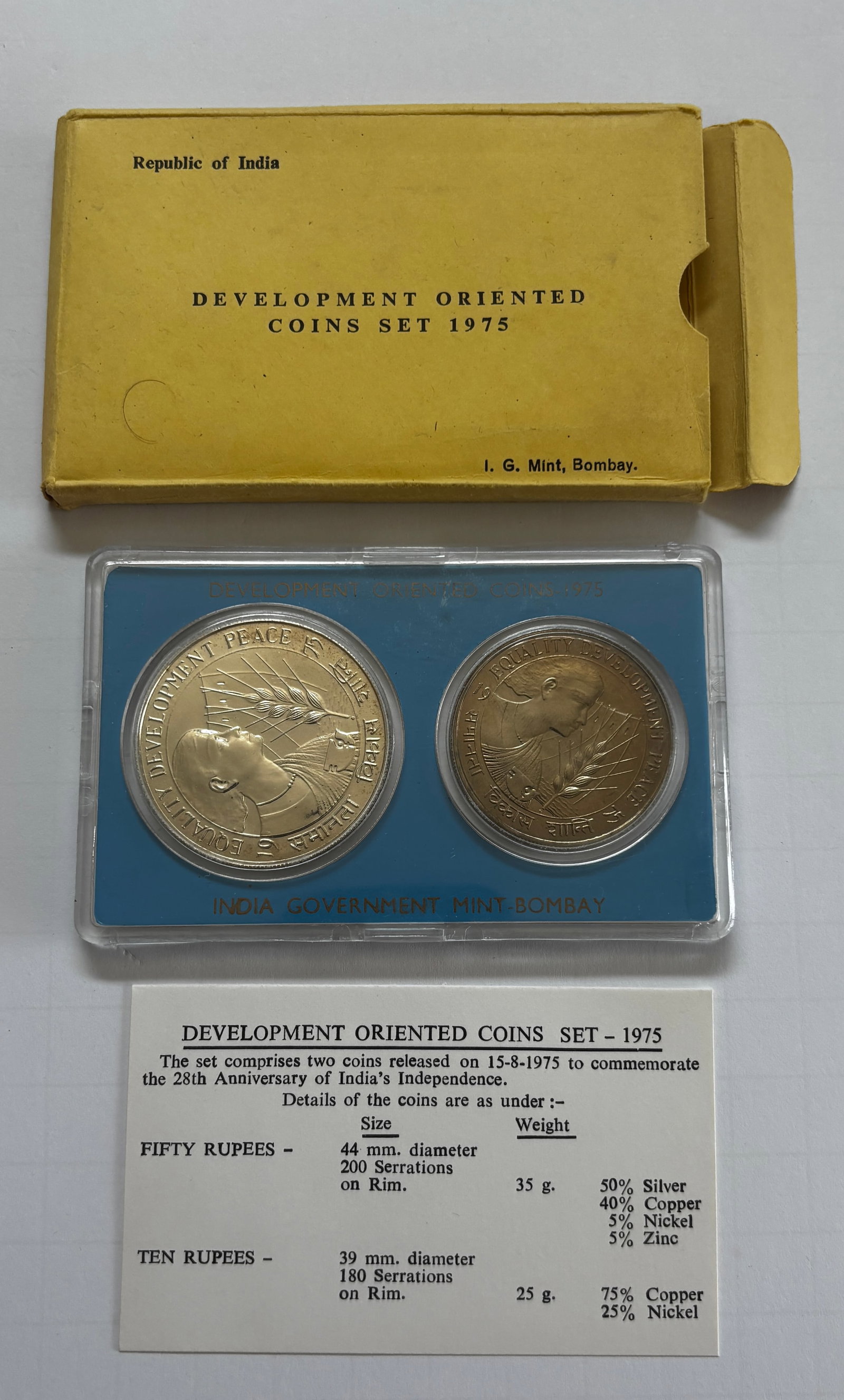 1975 India Development Oriented Coin Set: Republic of India 1975 Development Oriented coin set issued by the India Government Mint, Bombay, commemorating the 28th Anniversary of India’s Independence. Includes two commemorative coins housed 