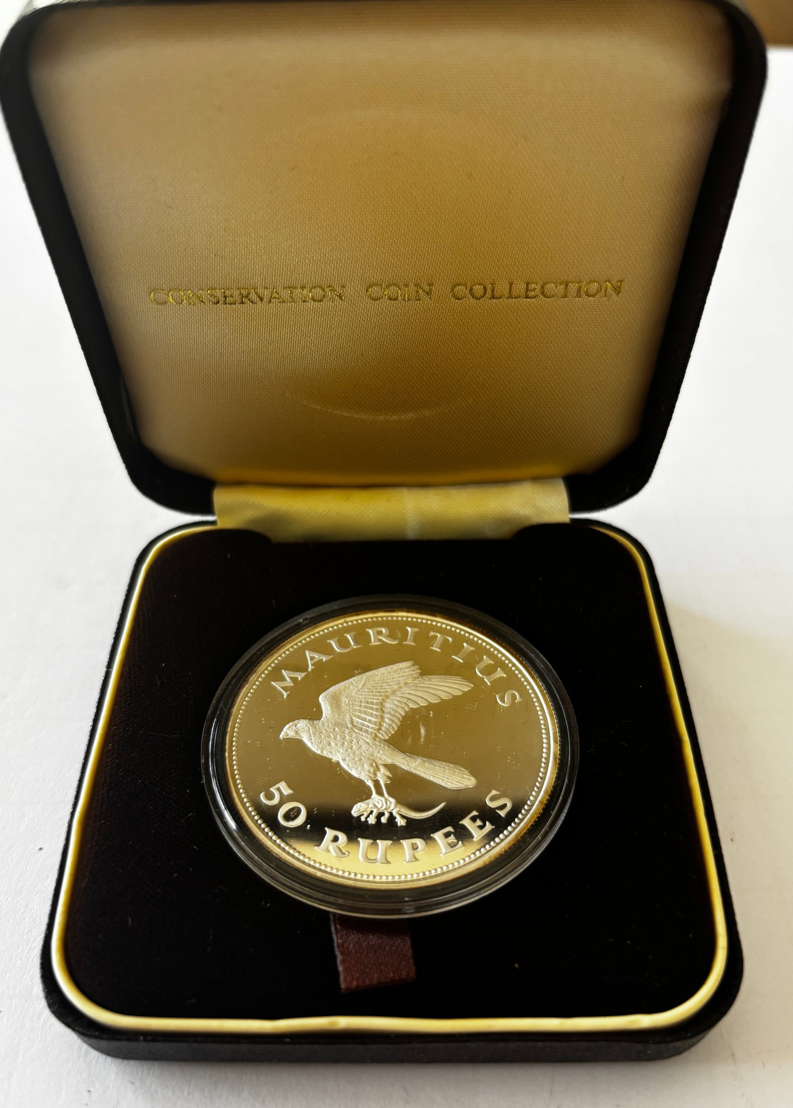 Mauritius 50 Rupees Proof Silver Coin: Mauritius 50 rupees proof coin from a conservation coin collection, struck in sterling silver, featuring detailed bird motif with outstretched wings and Queen Elizabeth II portrait on reverse,