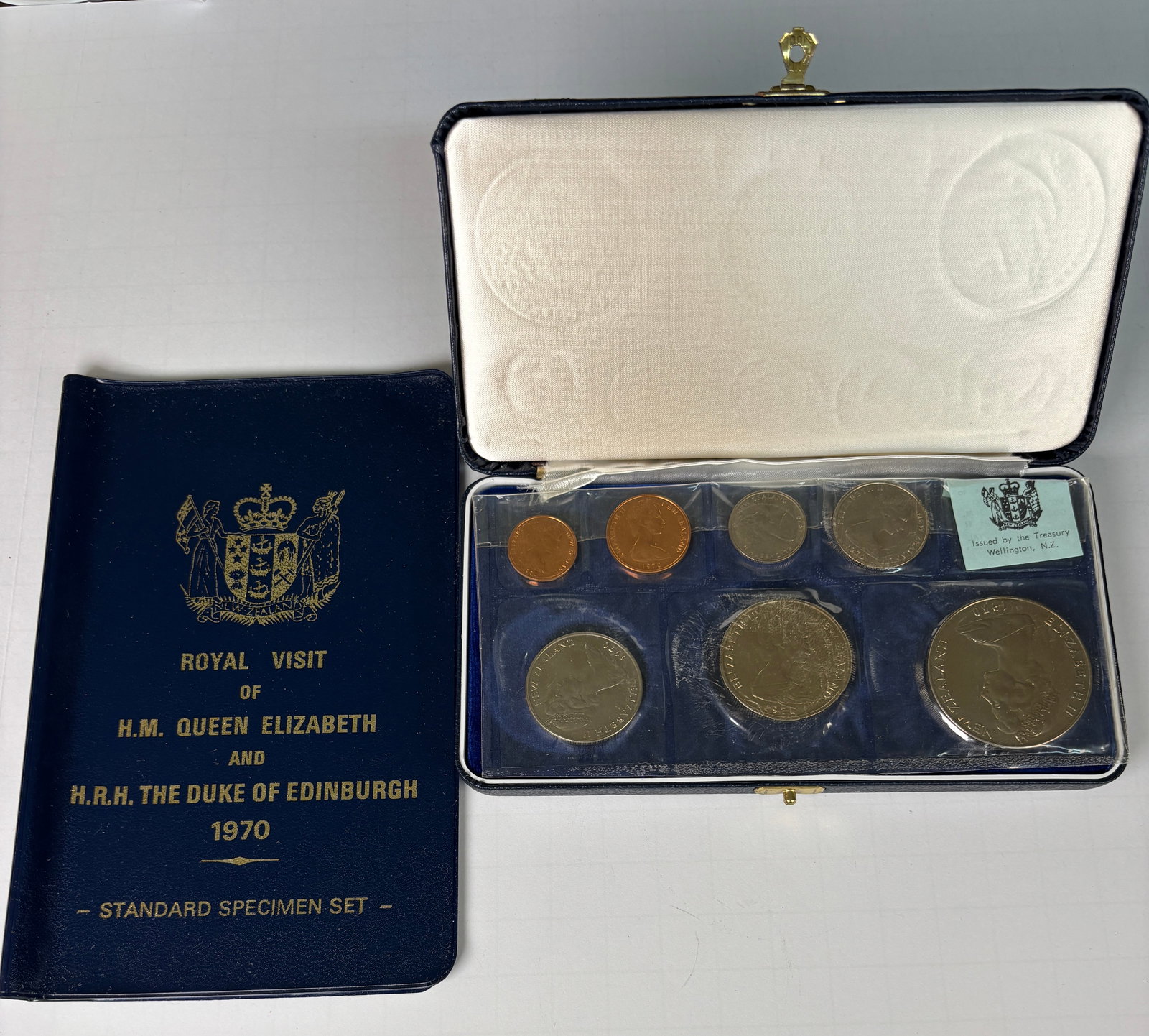 1970 New Zealand Royal Visit Specimen Coin Set Queen Elizabeth II Case: 1970 New Zealand Royal Visit specimen coin set issued for the visit of H.M. Queen Elizabeth II and H.R.H. The Duke of Edinburgh, housed in original fitted presentation case; includes multiple denomina