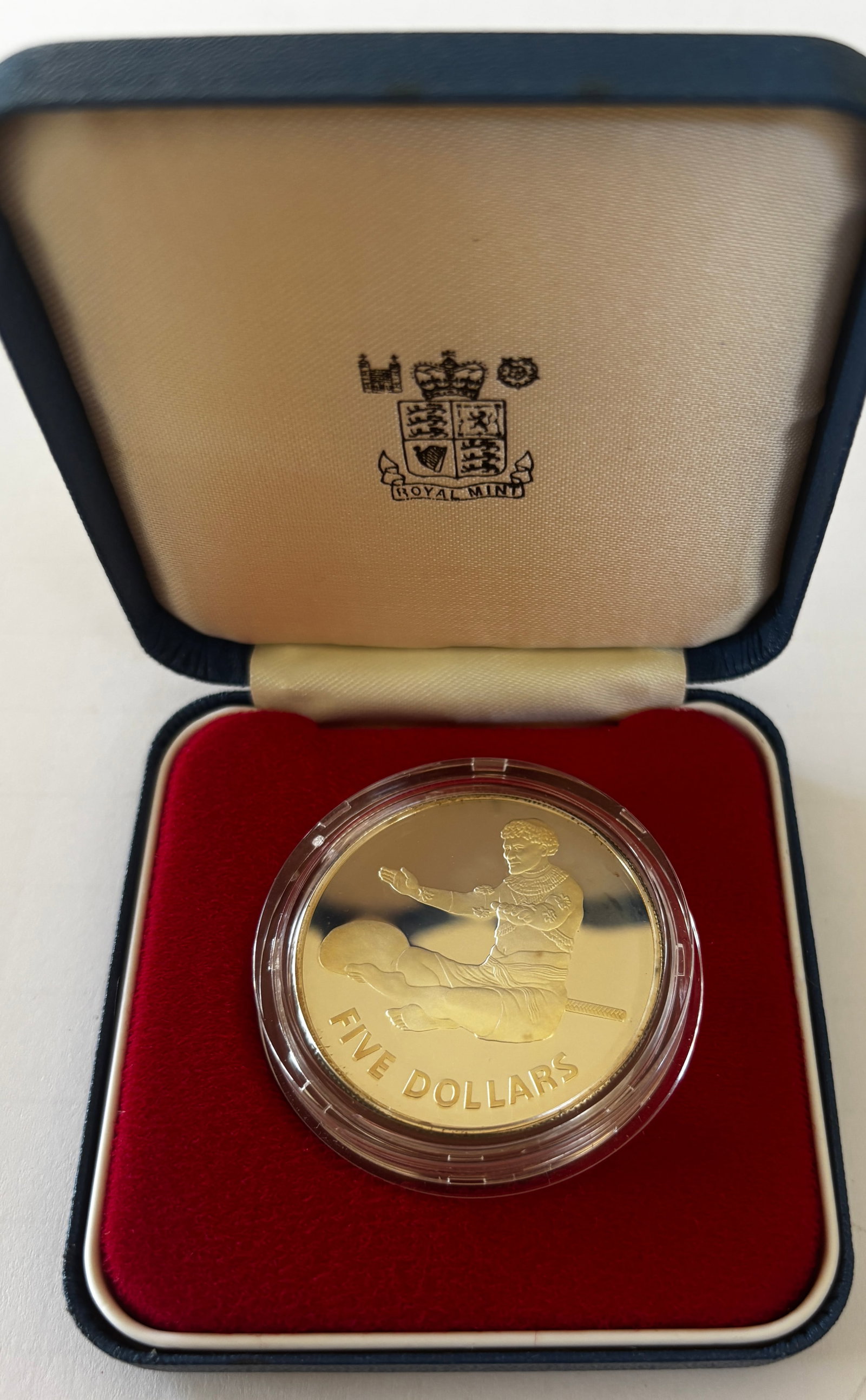 1979 Kiribati Silver Proof $5: 1979 Kiribati Five Dollars silver proof commemorative coin featuring traditional seated figure on obverse and national coat of arms on reverse, issued as part of the Commemorative Gold and Silver Coin