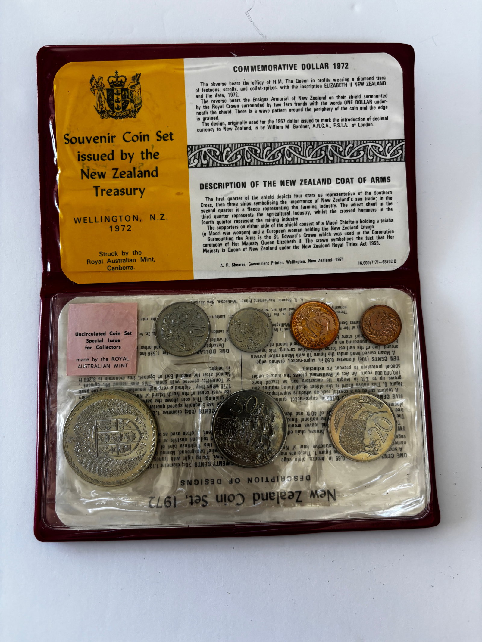 1972 New Zealand Treasury Souvenir Coin Set: 1972 New Zealand Treasury souvenir coin set issued by the Royal Australian Mint, Canberra, housed in original red presentation wallet with informational inserts and featuring uncirculated New Zealand 