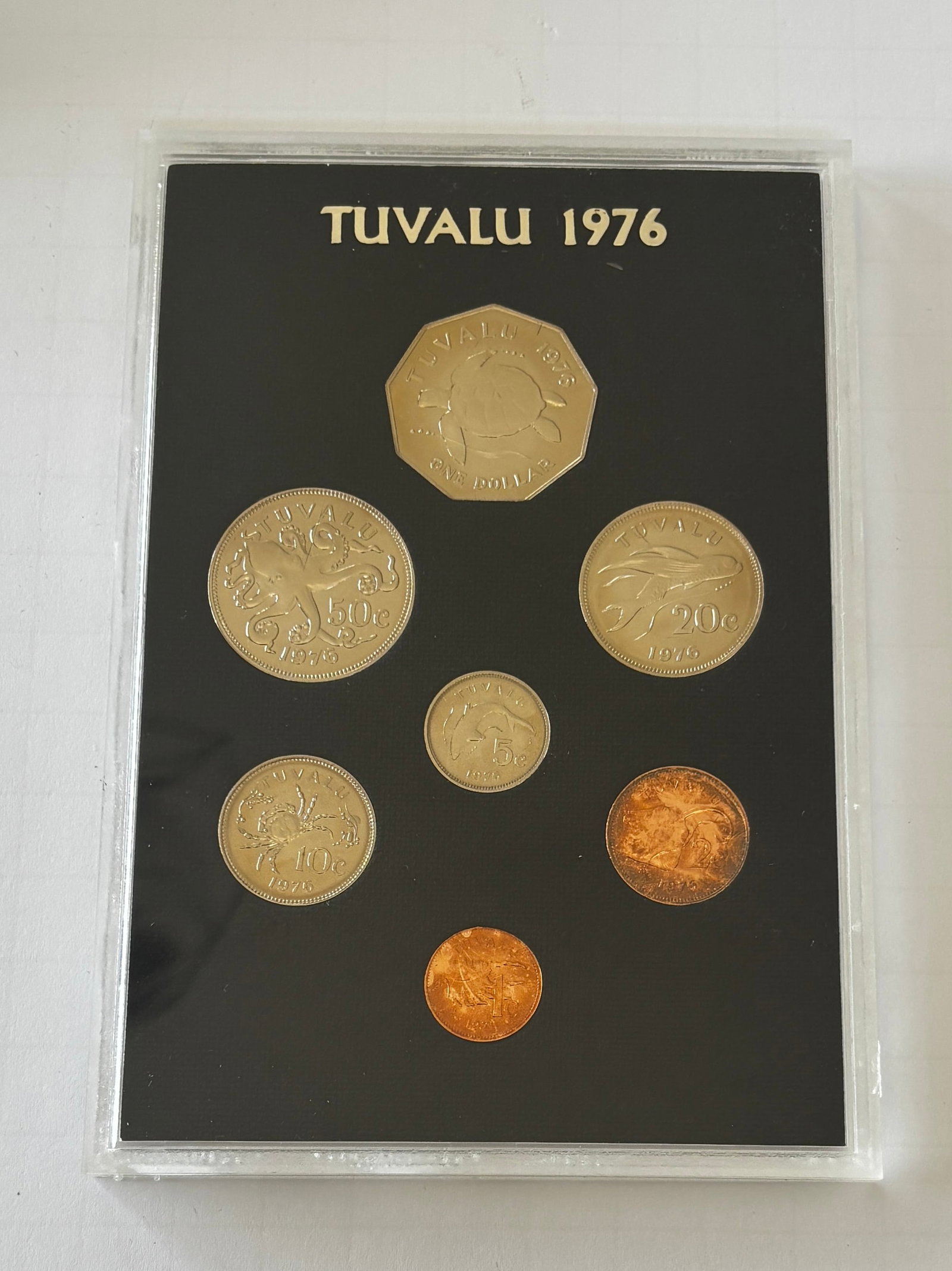 1976 Tuvalu First Coinage Set: 1976 Tuvalu “First Coinage” uncirculated set issued to commemorate the nation’s inaugural coinage, comprising denominations from 1 cent through 1 dollar, struck in mixed compositions includi
