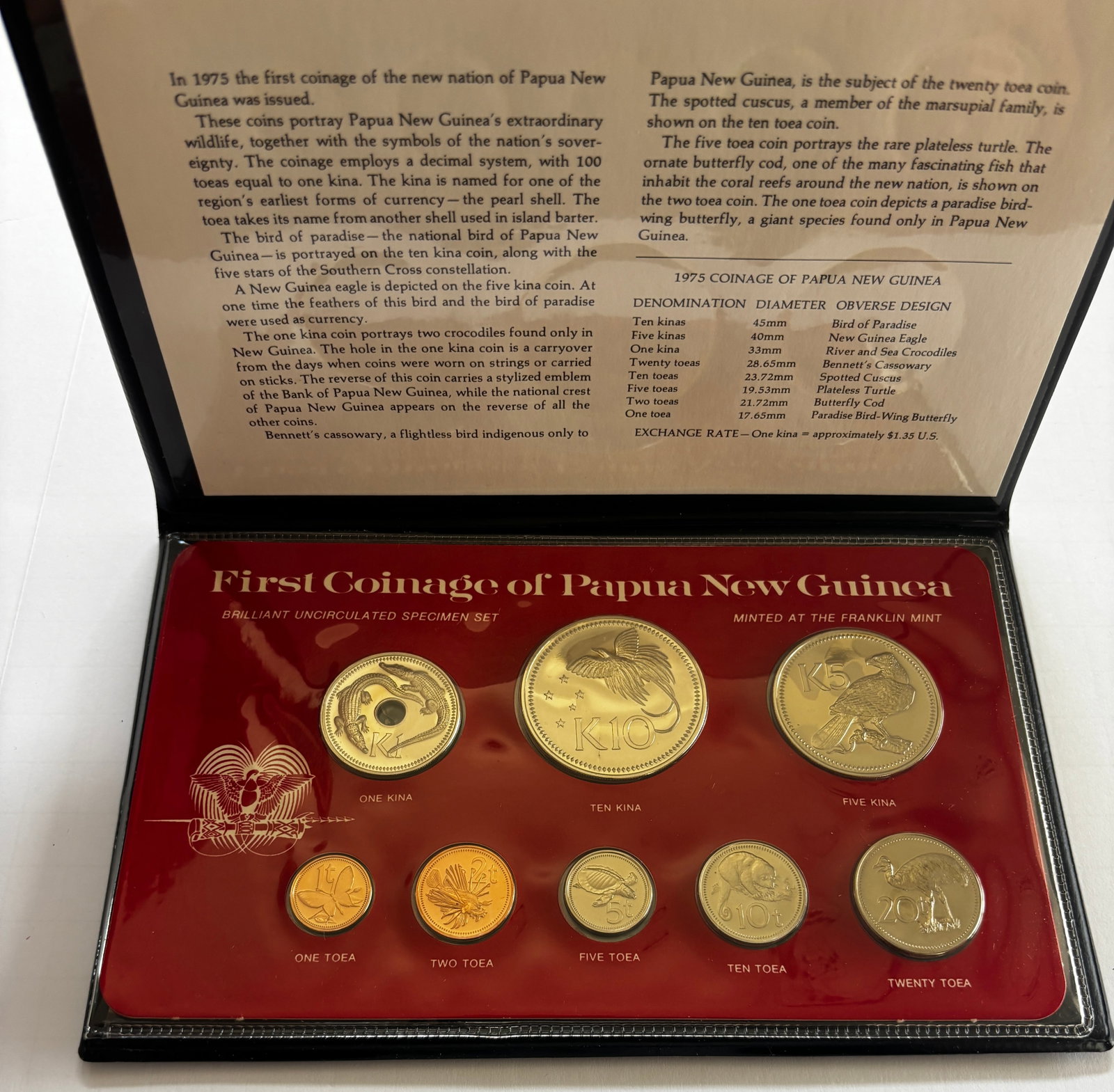 1975 Papua New Guinea Specimen Coin Set: First Coinage of Papua New Guinea 1975 brilliant uncirculated specimen set minted by The Franklin Mint, commemorating the first official coinage of the newly independent nation. Set includes seven coi