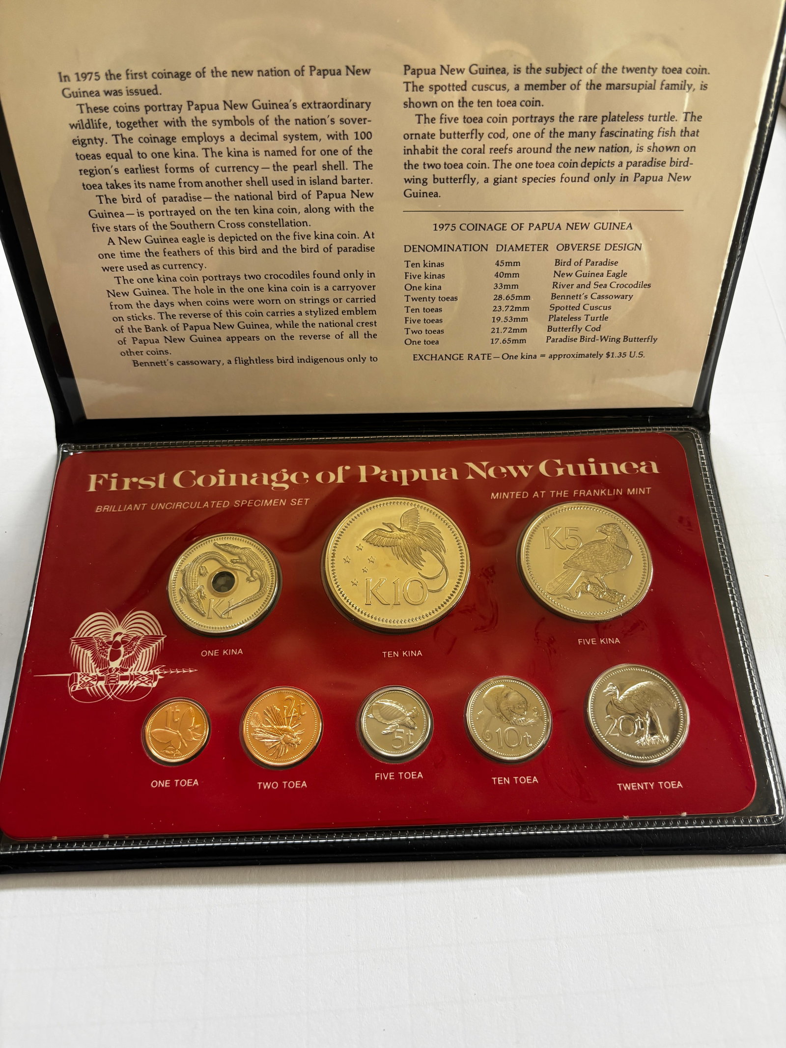 1975 Papua New Guinea Specimen Coin Set: First Coinage of Papua New Guinea 1975 brilliant uncirculated specimen set minted by The Franklin Mint, commemorating the inaugural coinage of the newly independent nation. Set includes seven coins ra