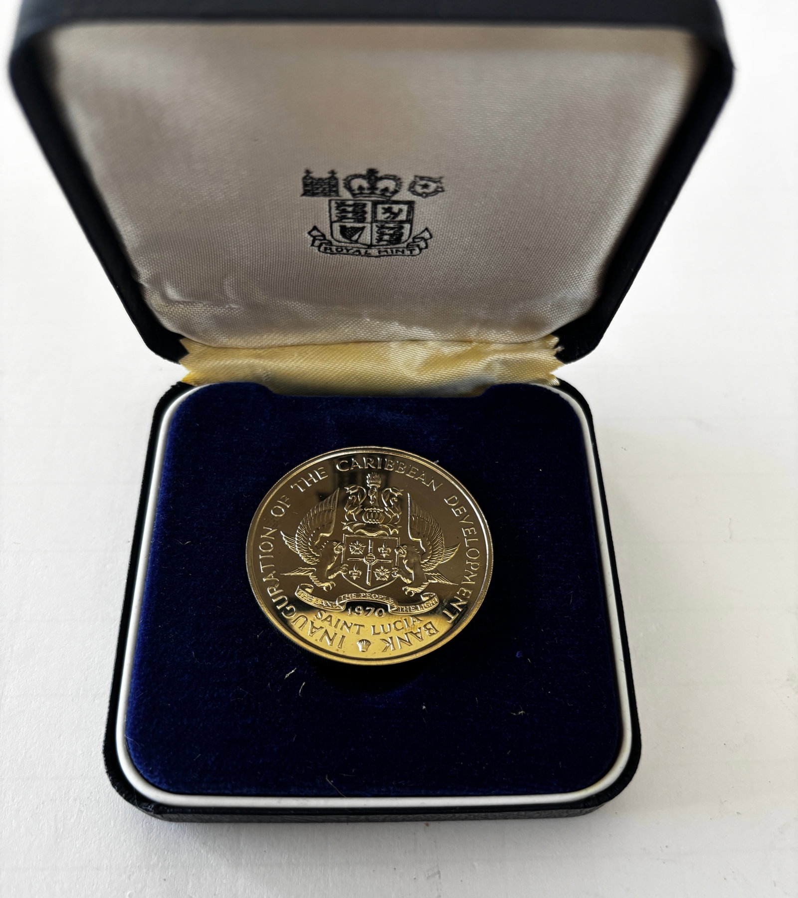 1970 Saint Lucia Caribbean Development Bank Proof Coin: 1970 Saint Lucia Caribbean Development Bank commemorative proof coin featuring the Saint Lucia coat of arms and “Inauguration of the Caribbean Development Bank” inscription to one side and “