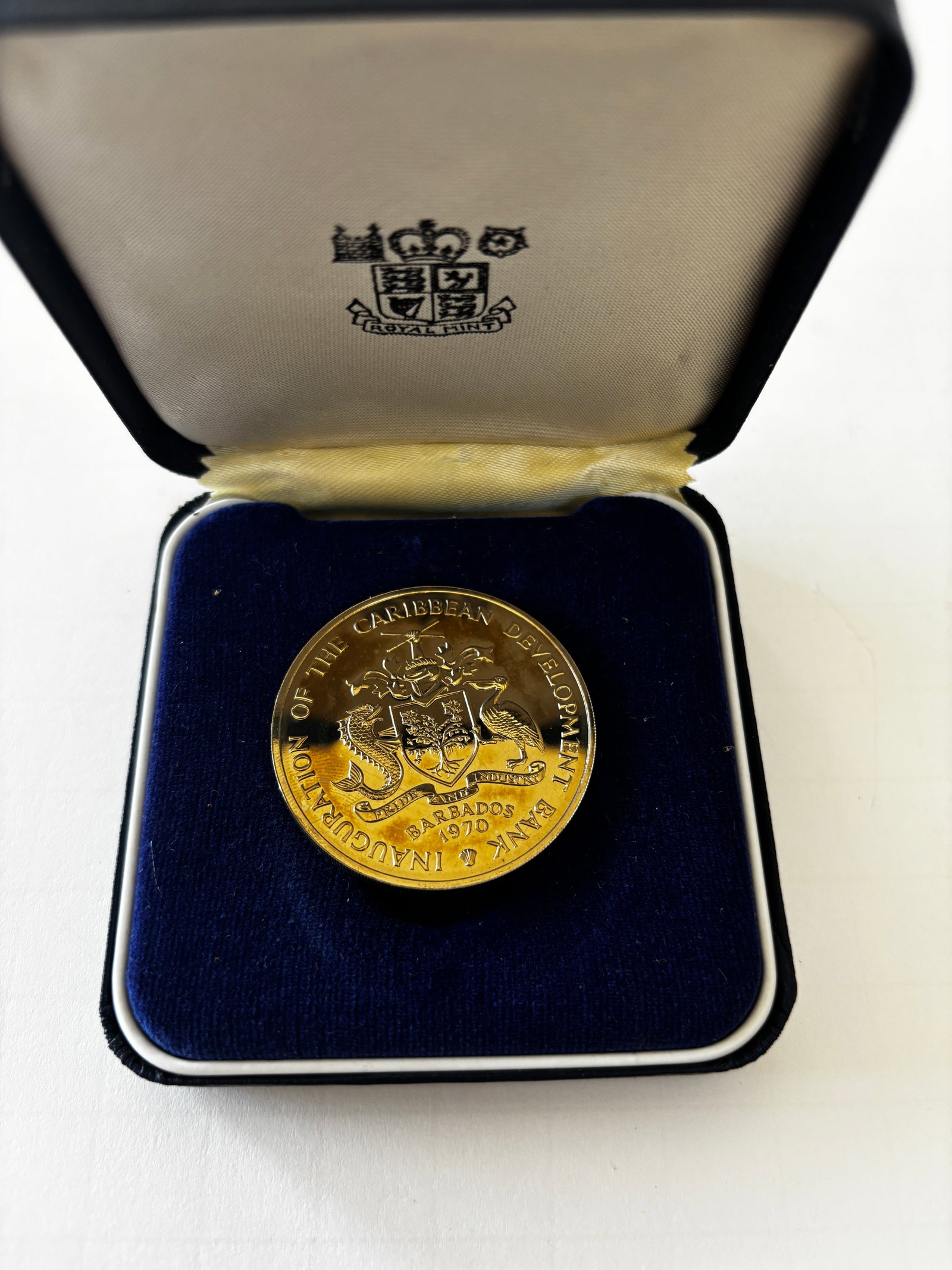 1970 Barbados Caribbean Development Bank Proof Coin: 1970 Barbados Caribbean Development Bank commemorative proof coin featuring the Barbados coat of arms and “Inauguration of the Caribbean Development Bank” inscription to one side and “Grow M