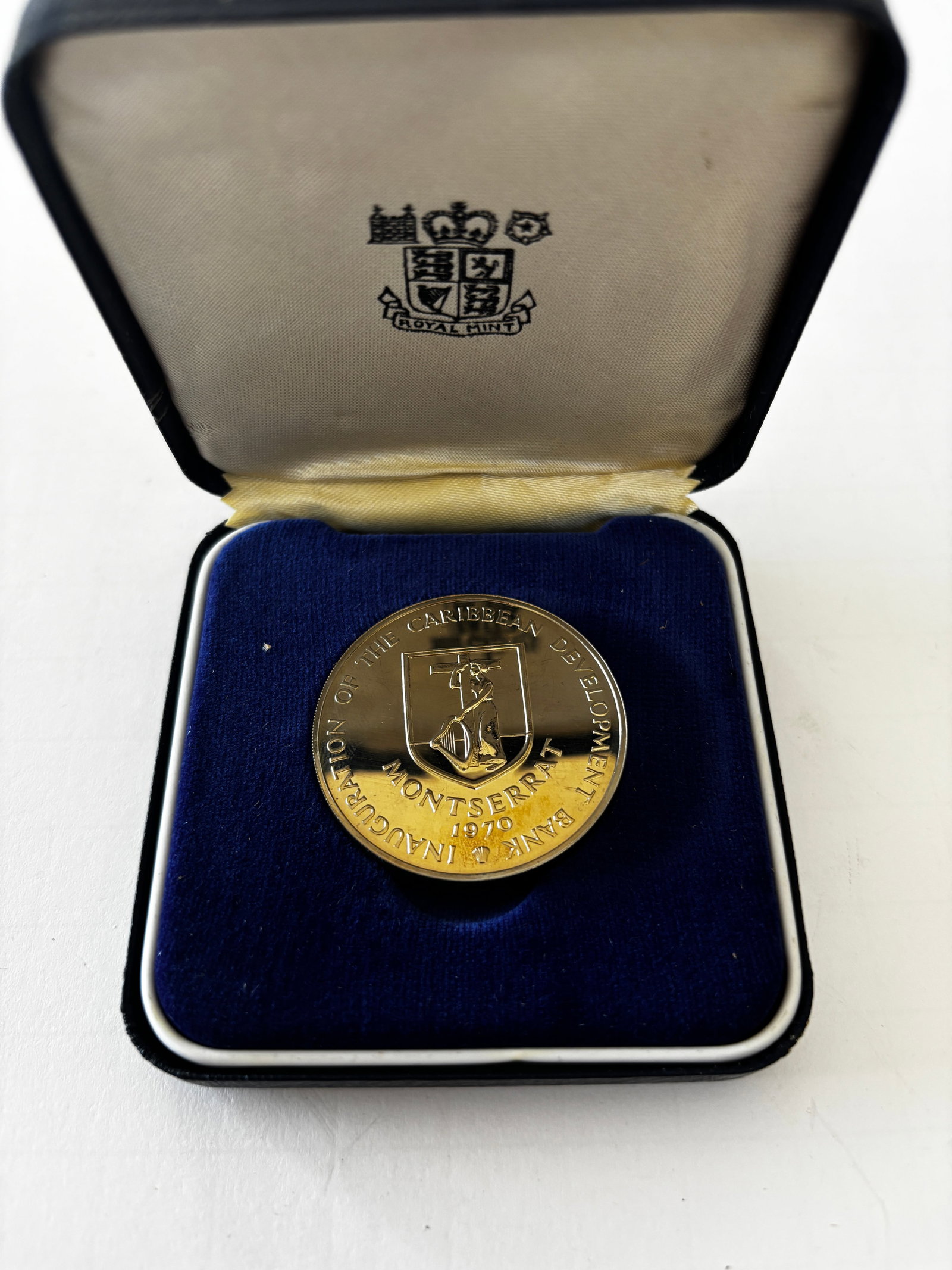 1970 Montserrat Caribbean Development Bank Proof Coin: 1970 Montserrat Caribbean Development Bank commemorative proof coin featuring the Montserrat coat of arms and “Inauguration of the Caribbean Development Bank” inscription to one side and “Gr