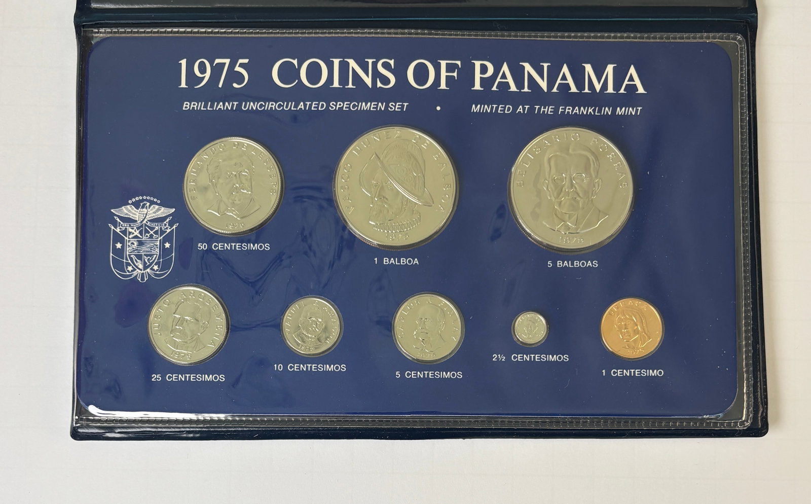 1975 Panama Eight Coin Brilliant Uncirculated Specimen Set Franklin Mint In Case: 1975 Republic of Panama eight coin brilliant uncirculated specimen set minted by the Franklin Mint, complete in original blue presentation case with protective plastic holder and original informationa