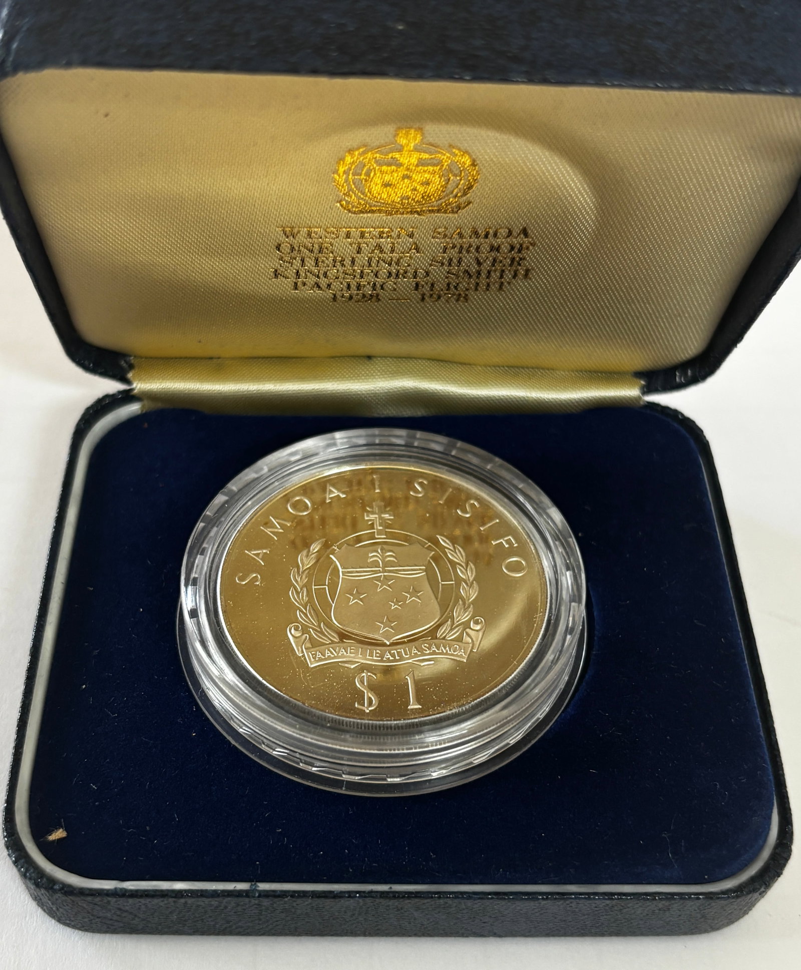 1978 Samoa Lindbergh Silver Proof Coin: 1978 Western Samoa One Tala silver proof commemorative coin honoring Charles Lindbergh’s 1928 first Pacific flight, featuring aircraft over map of Pacific with portrait on obverse and Samoan coat of