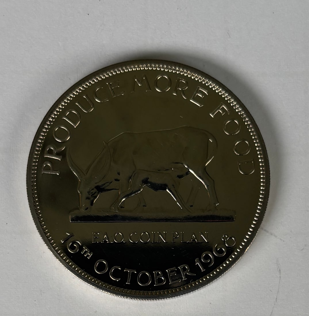 1968 Uganda Five Shillings Proof FAO Coin Plan UNC: 1968 Bank of Uganda Five Shillings proof coin issued for the FAO Coin Plan, dated October 16, 1968, featuring a grazing bull reverse and Ugandan coat of arms obverse; struck with mirrored proof fields
