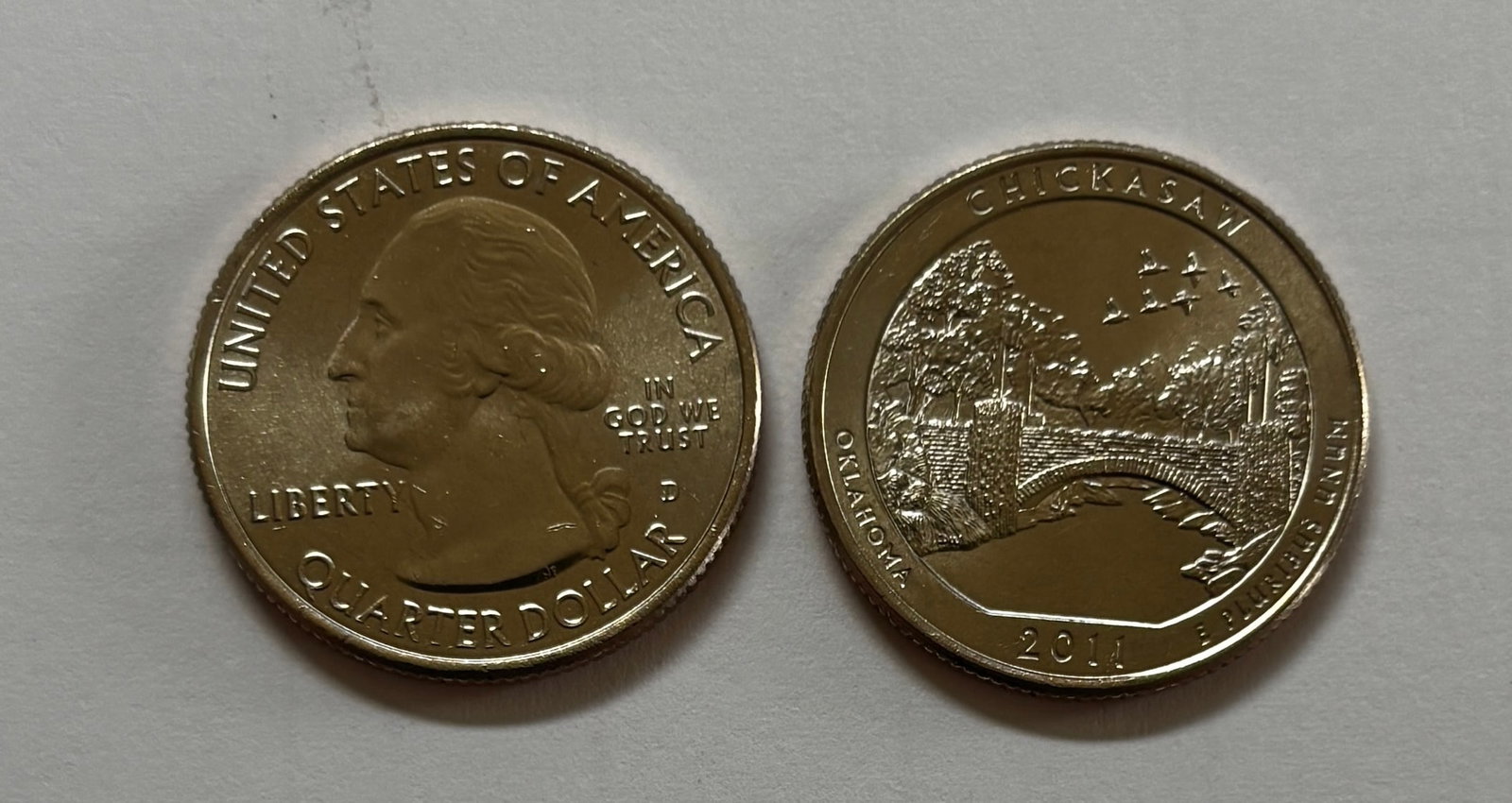 2010–2015 National Park Quarter Roll: Littleton Coin Company roll containing 27 uncirculated National Park quarters dated 2010–2015, including examples such as the 2011 Chickasaw National Recreation Area quarter and 2012 Hawai‘i Volca