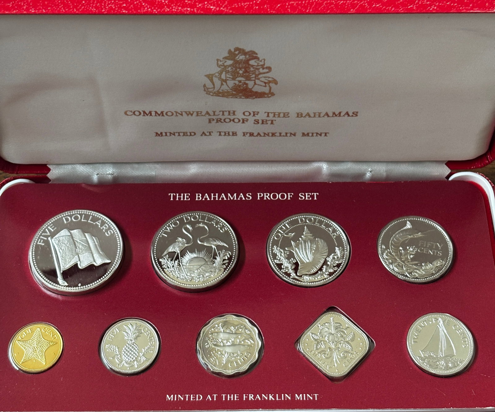 1981 Commonwealth of the Bahamas Proof Coin Set with Original Case and Certificate – Franklin: Complete 1981 Commonwealth of the Bahamas Proof Coin Set minted by the Franklin Mint under authorization of the Central Bank of the Bahamas. Includes the original fitted presentation case, Certificate