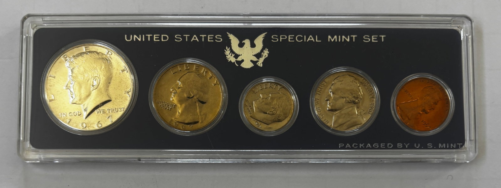 1967 United States Special Mint Set (SMS), Original Mint Holder: Official 1967 United States Special Mint Set issued by the United States Mint and housed in the original hard plastic holder. The set contains the five-coin denomination lineup produced during the fin