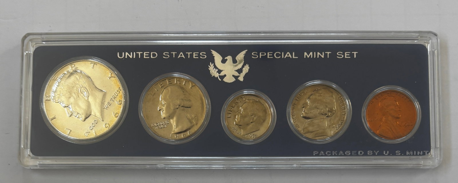 1966 United States Special Mint Set (SMS), Original Mint Holder: Official 1966 United States Special Mint Set (SMS) containing five coins housed in the original hard plastic Mint holder. The set includes the 1966 Kennedy half dollar, Washington quarter, Roosevelt d
