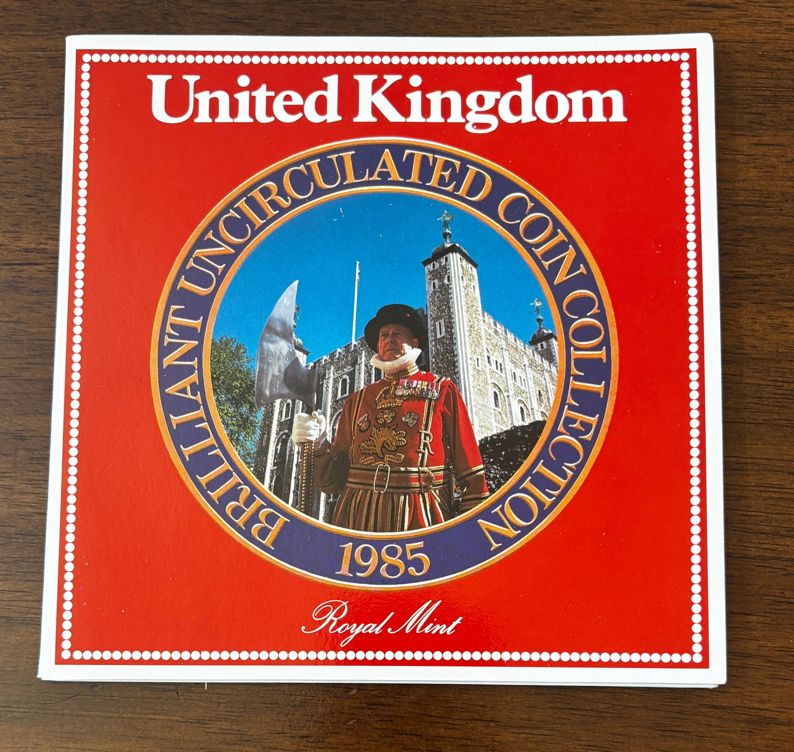 1985 United Kingdom Brilliant Uncirculated Coin Collection: Official 1985 Royal Mint Brilliant Uncirculated Coin Collection housed in its original presentation folder. The set contains seven United Kingdom coins dated 1985, including the £1, 50 pence, 20