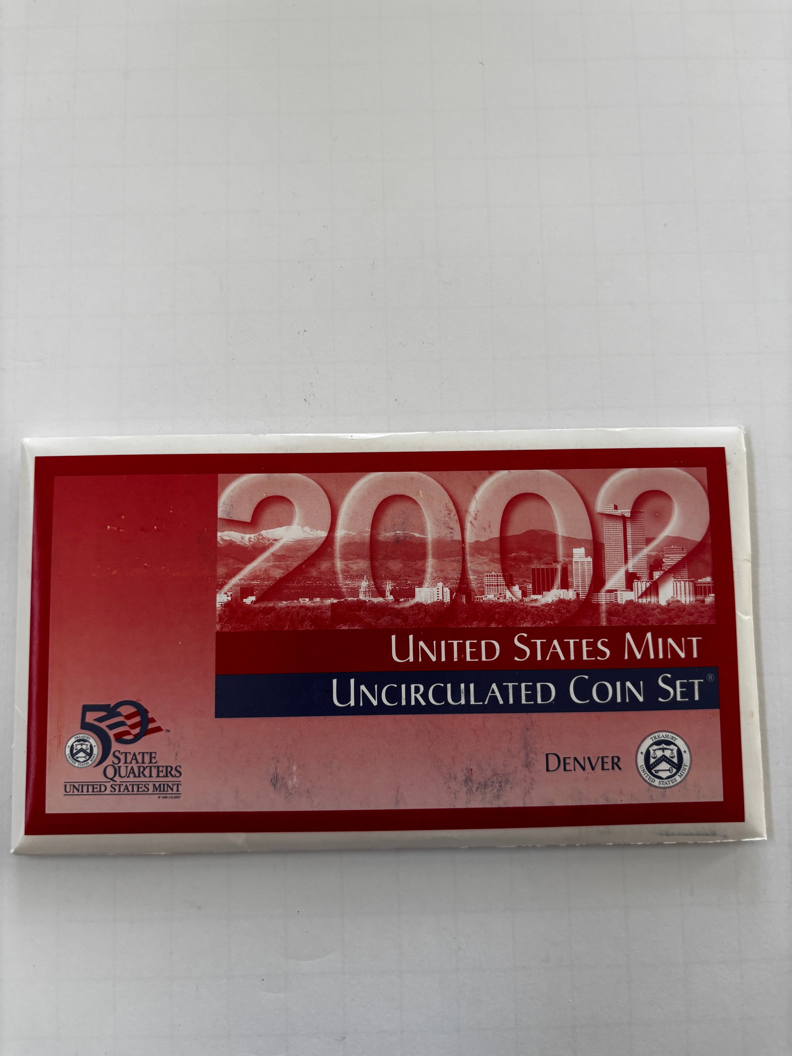 2002 United States Mint Denver Uncirculated Coin Set with Certificate of Authenticity: Official 2002 United States Mint Denver Uncirculated Coin Set housed in its original government packaging with Certificate of Authenticity. The set includes Denver Mint examples of the Lincoln cent, J