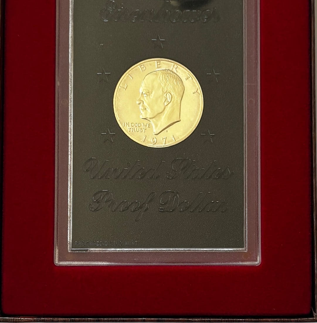 1971-S Eisenhower “Brown Ike” 40% Silver Proof Dollar in Original U.S. Mint Display Case: First-year issue 1971-S Eisenhower (“Ike”) 40% Silver Proof Dollar presented in its original U.S. Mint “Brown Ike” display case. Issued by the San Francisco Mint, these proof dollars f
