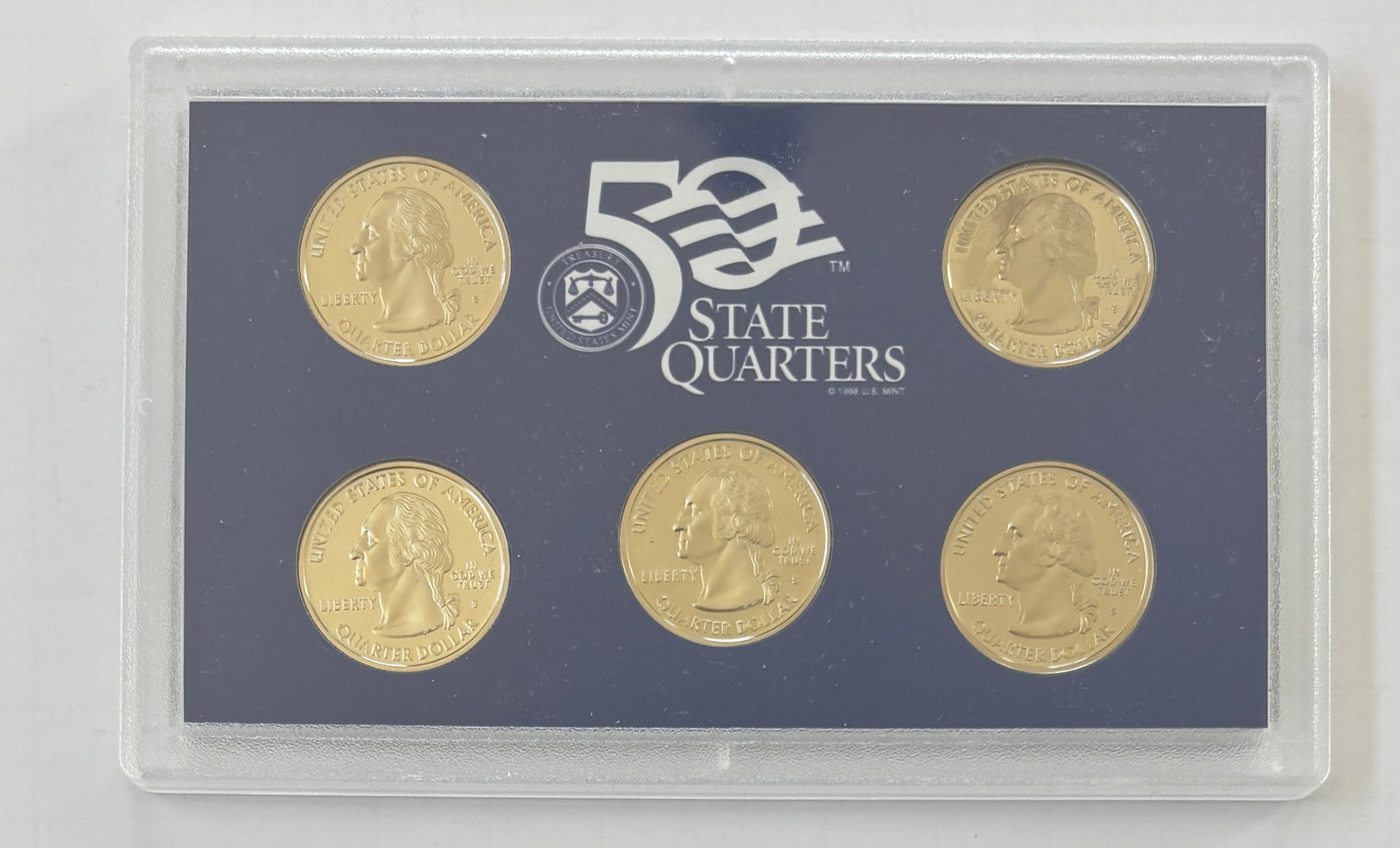 2003 United States Mint 50 State Quarters Proof Set, Original Government Packaging: Official 2003 United States Mint 50 State Quarters Proof Set presented in its original government holder with certificate of authenticity and outer sleeve. The set contains the five proof State Quarte
