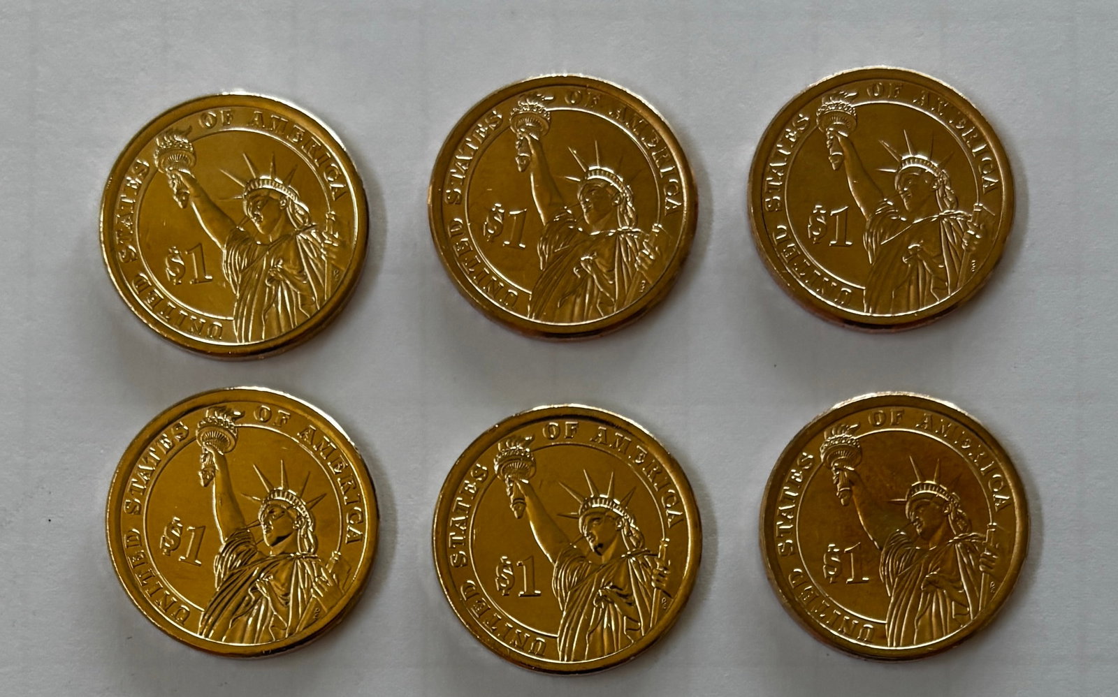 Six Presidential $1 Coins Including Gerald Ford, Ronald Reagan & Richard Nixon: Group of six (6) Presidential $1 Coins consisting of Gerald R. Ford, Ronald Reagan, and Richard M. Nixon dollar coins. The lot includes two examples each of Ford, Reagan, and Nixon issues. Coins featu