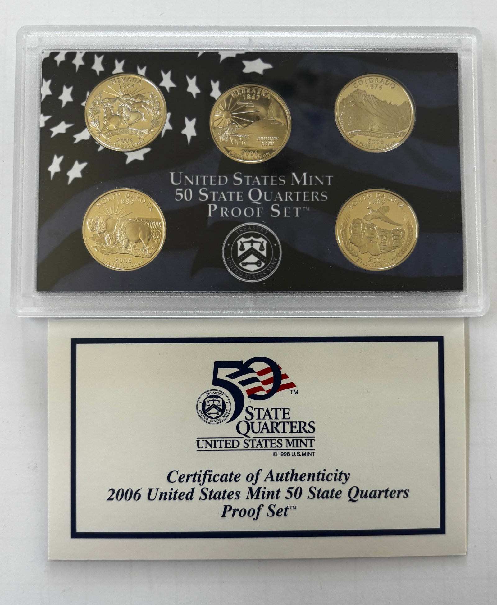 2006 United States Mint 50 State Quarters Proof Set with Original Packaging: Official 2006 United States Mint 50 State Quarters Proof Set housed in its original government holder with certificate of authenticity and outer sleeve. This proof set contains the five commemorative 