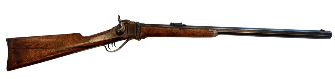 Sharps Model 1874 Sporting Rifle, Heavy Octagon Barrel, Double Set Triggers, .44 Caliber: Offered is an antique Sharps Model 1874 Sporting Rifle featuring a heavy octagon barrel, double set triggers, walnut stock with pewter fore-end tip, and steel shotgun-style buttplate. The rifle is mar