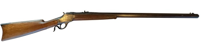 Winchester Model 1885 Single Shot Rifle .40-90 S.S.: Winchester Model 1885 single shot rifle chambered in .40-90 S.S. (Sharps Straight), featuring an octagonal barrel marked “40-90 S.S.,” walnut stock, and blued steel components with classic fal