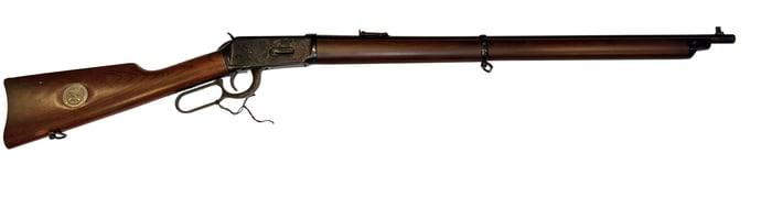 Winchester Model 94 NRA Centennial Musket .30-30 Lever-Action Rifle: Winchester Model 94 NRA Centennial Musket lever-action rifle, chambered in .30-30 Winchester, featuring walnut stock with inset NRA medallion, blued barrel, full-length magazine, barrel band, and leve