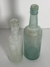 Antique Worcestershire Sauce Bottles Stag Head Embossed & Stoppered Aqua Example: Antique 2pc Worcestershire sauce bottle lot incl. aqua example with original glass stopper (approx. 9") and smaller Stag Head embossed bottle (approx. 7")