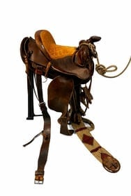 Vintage Western Tooled Leather Saddle, 17” Seat, Full QH Gullet: Vintage western saddle with deep tooled leather seat featuring leaf and scroll pattern, contrasting smooth leather skirts, raised cantle, and classic working-ranch profile. Includes horn, leather fend