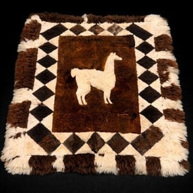 Patchwork Area Rug with Llama Motif: Patchwork Area Rug with Llama Motif – natural sheepskin patchwork rug featuring central white llama figure on brown field with diamond border in cream, brown, and black; approx. 5 ft 9 in L x 4 ft 6