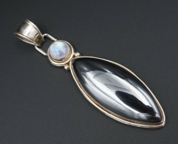 Sterling Silver Moonstone Pendant Artisan Hematite Cabochon Statement 3" PS1863: This beautiful sterling silver statement pendant features a long marquise shaped hematite cabochon with a moonstone accent. Both cabochons are bezel set with silver bead accents, creating a wonderful