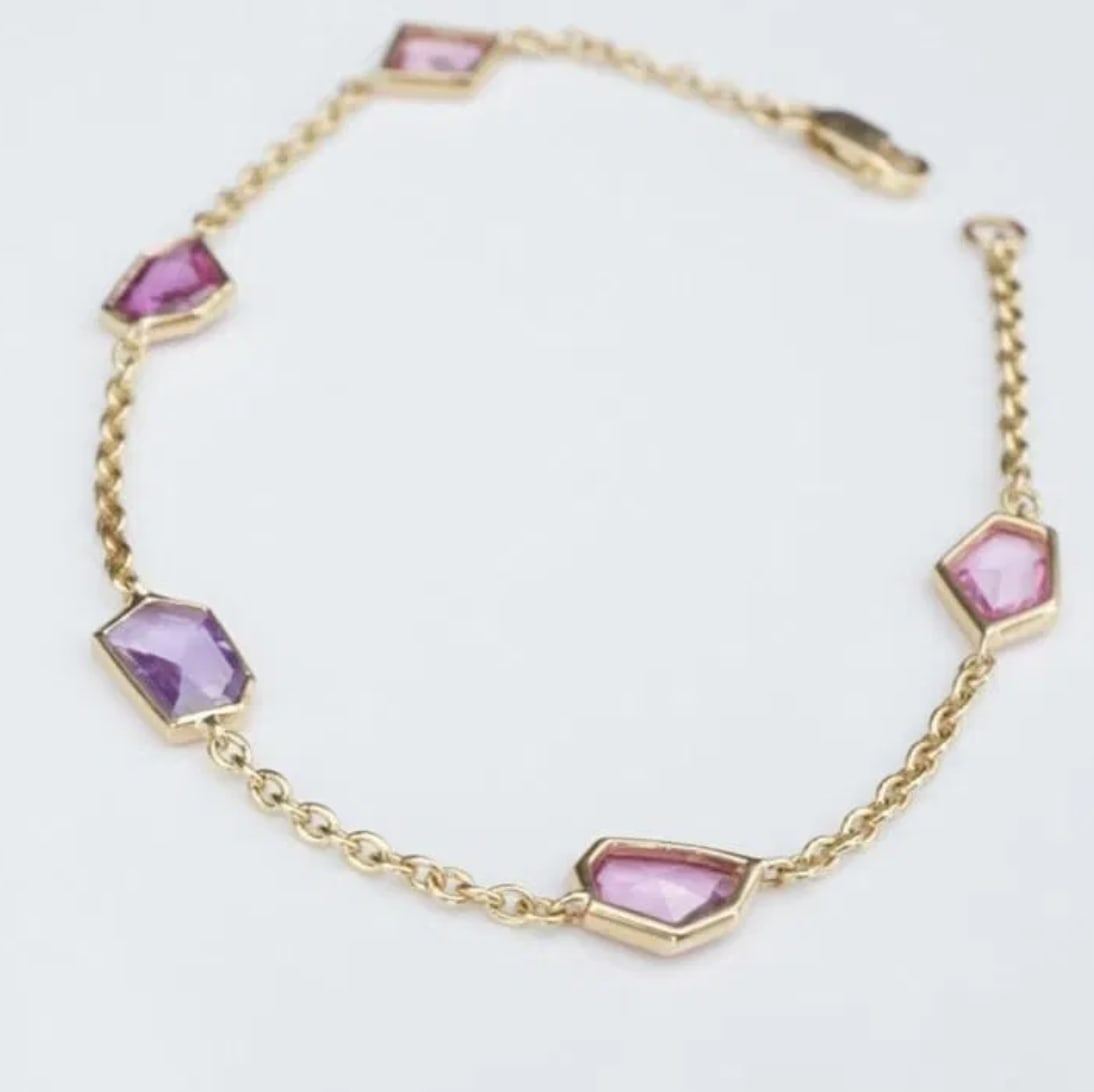 New 14k Yellow Gold Pink Purple 3 carat Sapphire 5 Station Bracelet 7" BG739: This bracelet features five fancy cut sapphire stations bezel-set on a luxe 14k yellow gold chain. With a trendy pink to purple ombre color palette, this bracelet is perfect worn on its own or added t