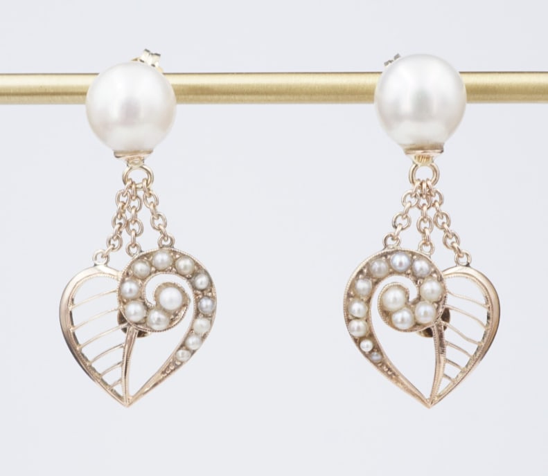 Antique Yellow Gold Akoya Pearl Heart Post Dangle Earrings 1.25" 8mm EG2243: These beautiful earrings feature classic 8mm Akoya pearl studs accentuated with seed pearl studded open hearts dangling beneath. The articulated design displays lots of movement when worn. A beautiful