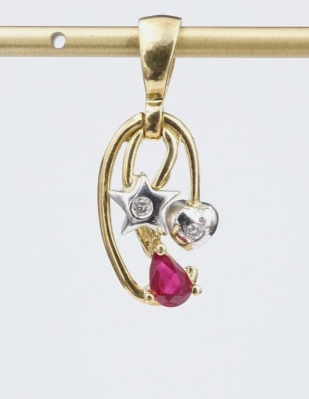 Vintage 18k Ruby White Diamond Pendant Yellow Gold 1" Natural Star PG1869: This luxe ring features a gorgeous deep red pear cut ruby set at the bottom of an open work pendant. A white gold star and heart are each adorned with a white diamond. This stunner is crafted of 18k w