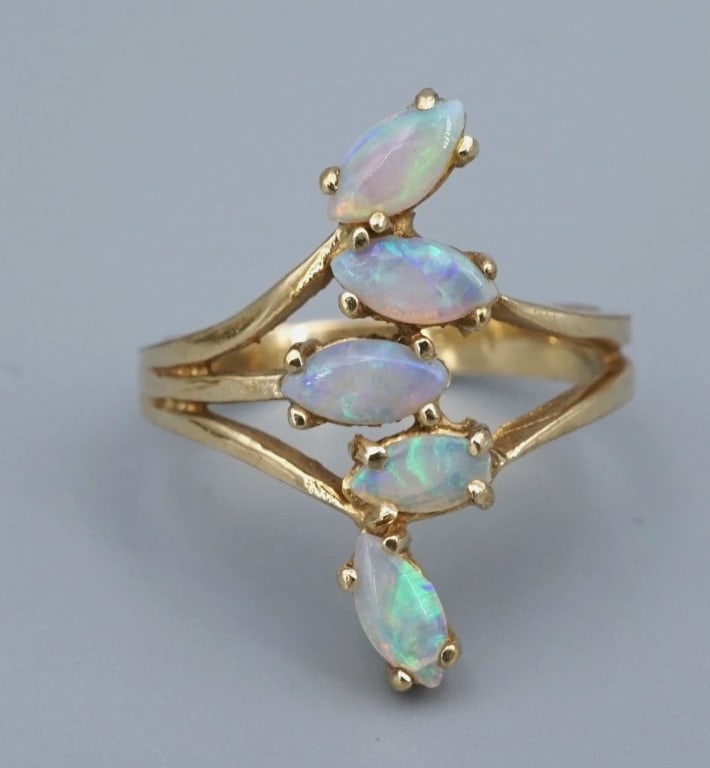 Vintage 14k Opal Spray Ring Cocktail Bypass Yellow Gold Sz 6.75 Statement RG4965: This beautiful ring features a wide spray of opal marquise cabochons, shimmering with green, purple, and orange. The gems are set atop a wide split shank band crafted of 14k yellow gold. This gorgeous