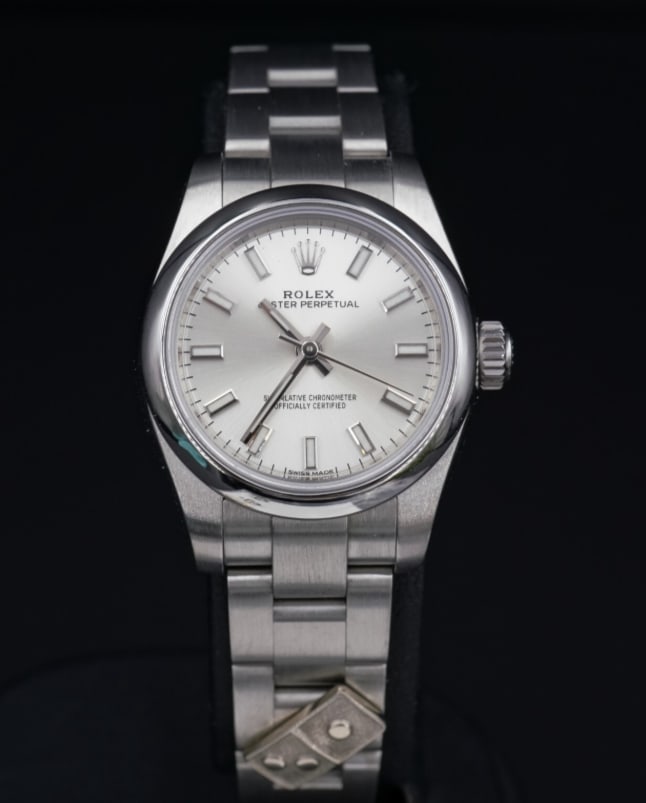 2016 Ladies Dominos Pizza Rolex 176200 SS Warranty 26mm Oyster Box Papers W591: Guaranteed authentic Ladies Rolex Dominos Pizza model 176200. This classic watch features a solid stainless-steel case, oyster link bracelet, sapphire crystal, silver dial with baton markers, and a do