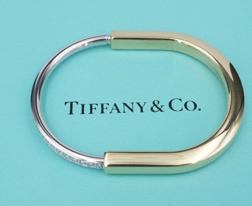 Tiffany Lock Wide Diamond Hinged Bangle 1.2ct 18k Yellow Gold Bracelet 7" BG1026: The Tiffany Lock is an expression of love’s enduring protection, inspired by a padlock from The Tiffany Archives that dates to 1883. Designed to keep safe that which is cherished, Lock is a universa