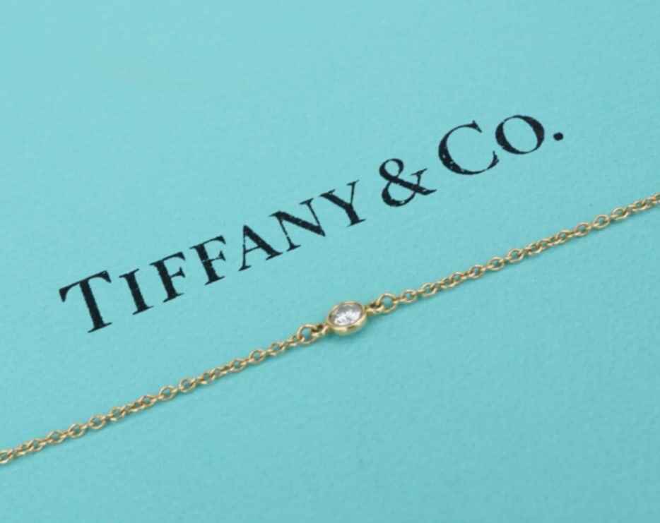 Tiffany & Co. Elsa Peretti Diamond DBTY Bracelet 18k Yellow Gold 6.5" BG1022: This adorable Tiffany & Co. bracelet by designer Elsa Peretti features bezel set diamonds set on a sturdy cable link chain. Set in solid 18k yellow gold, this piece is amazing on its own or layered wi