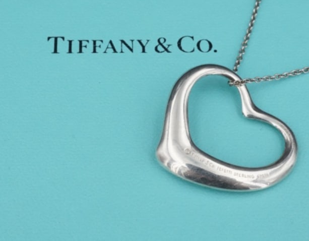 Tiffany Co Large Open Heart Pendant Necklace Peretti Sterling Silver 30" NS2316: This classic Tiffany & Co. necklace by designer Elsa Peretti features her iconic open heart design crafted of solid sterling silver hanging from a delicate 30" cable chain. Described by Tiffany as "Th