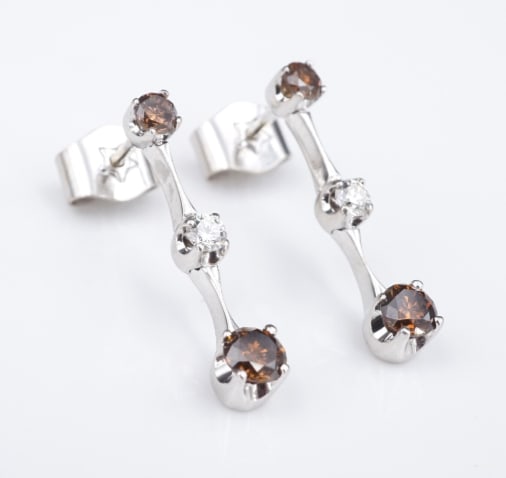 H. Stern 18k White Gold Diamond Fancy Chocolate Diamond Drop Earrings EG2237: This pair of lovely H. Stern designer earrings each feature a bright vertical bar design accented by white and vivid cognac-colored diamonds. All crafted in bright 18k white gold. A gorgeous addition