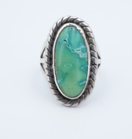 Southwestern Turquoise Cabochon Ring Natural Size 5.5 Vintage Artisan RS3806: This beautiful Southwestern artisan-made ring features an elongated turquoise cabochon bezel set atop a tapered, split shank band with intricate rope details. A great addition to any Southwestern jewe