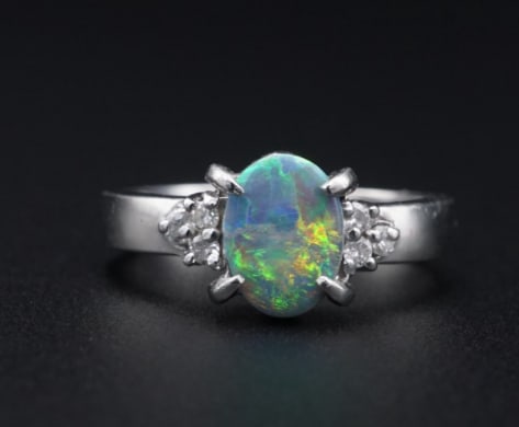 Vintage Platinum Oval Black Opal Diamond Cocktail Ring Size 5.75 RG4232: This beautiful ring features a stunning black opal accented with clusters of sparkling white diamonds on both shoulders, all crafted in solid platinum. The stunning color contrast gives this ring a lu
