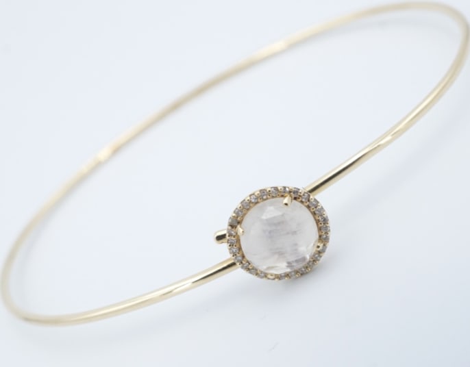 14k Yellow Gold Moonstone Diamond Bangle Bracelet Hook-On 6.25" BG1114: This gorgeous hook-on bangle is set with a faceted moonstone cabochon ringed with a sparkling halo of diamonds. The slim tensioned round wire hooks onto itself. Crafted of solid 14k yellow gold. A sle