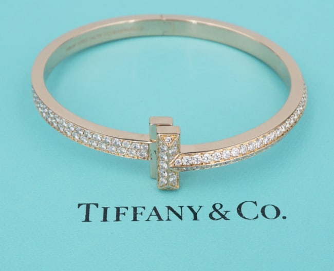 Tiffany T T1 Wide Diamond Hinged Bangle 4.08ct 18k Rose Gold Bracelet BG1078: This Tiffany & Co. bracelet is a gorgeous modern classic. The T T1 wide bangle features over 4 carats of diamonds, set in the iconic T cuff hinged bangle, with pave diamonds on all sides. Described by