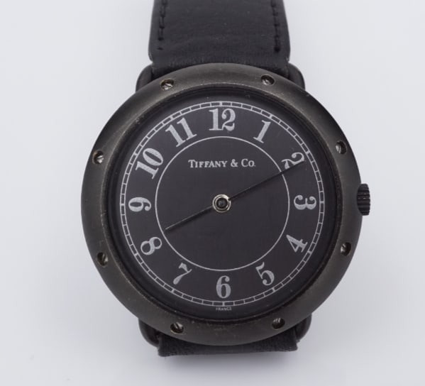 Tiffany Black PVD Watch Quartz 35mm Leather Strap Rare French W789: This beautiful Tiffany & Co watch features a black PVD stainless round case with a black leather strap. Manufactured in France. Metal Type: Stainless steel Notable Marks: France; Movement: Quartz Meas