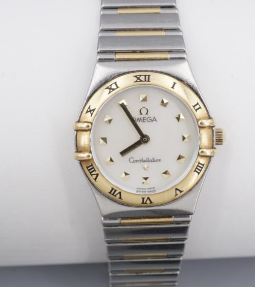 Omega Constellation SS 18k Gold 22.5mm Watch Half Bar "My Choice" Quartz W1276: This iconic Omega Lady Constellation quartz, famously promoted in the 90s as Cindy Crawford's "My choice", features a 22.5mm case in steel and yellow gold, mother of pearl dial and stainless steel/ ye