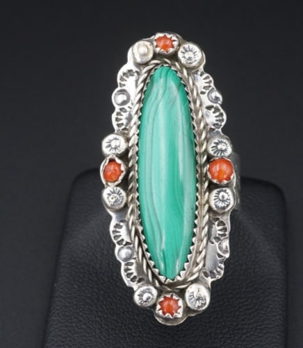 Navajo Malachite Coral Ring Sterling Silver Size 7 1.7" Long Signed E RS3389: This beautiful Navajo ring features a gorgeous polished slab of green malachite with a natural matrix, set in a classic bezel with a leaf and blossom border. The border is accented with small coral ca