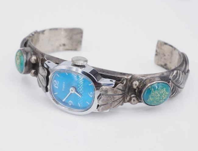 Navajo Turquoise Watch Cuff Sterling Silver Turquoise Signed K.M. 7" W868: This Navajo artisan watch cuff features beautiful oval turquoise cabochons bezel set on each arm. Feather and ball accent details complete the look. Crafted of solid sterling silver, this watch is gre